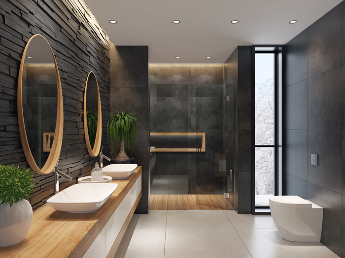 Ett modernt badrum med svarta väggar och trädetaljer.