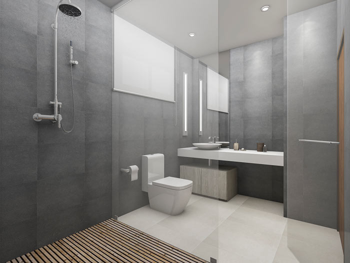 En modern dusch med stor glasvägg i ett grått badrum.